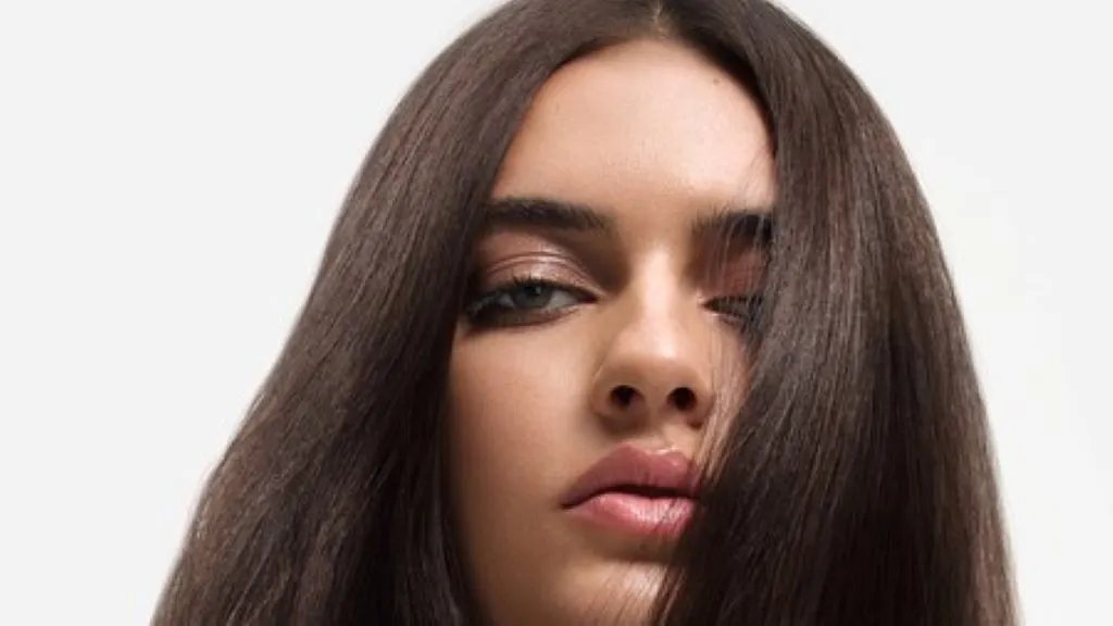 Model with long straight brunette hair.