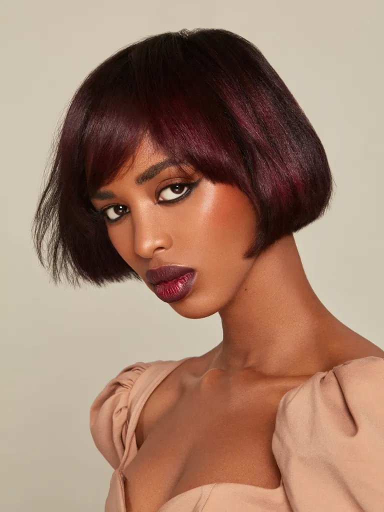 Model with cherry chocolate, bob haircut.