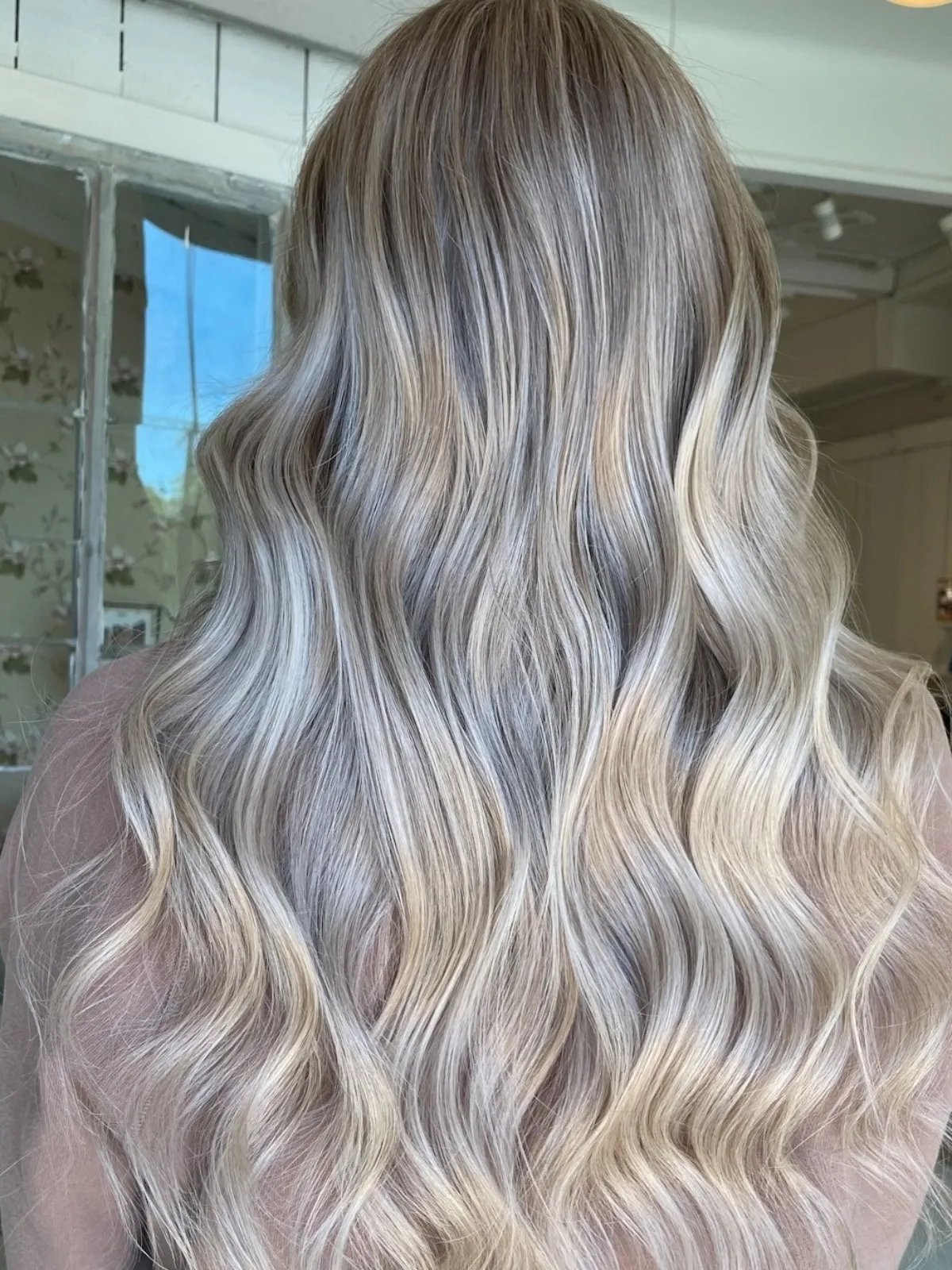 Model with long, wavy, silver hair.