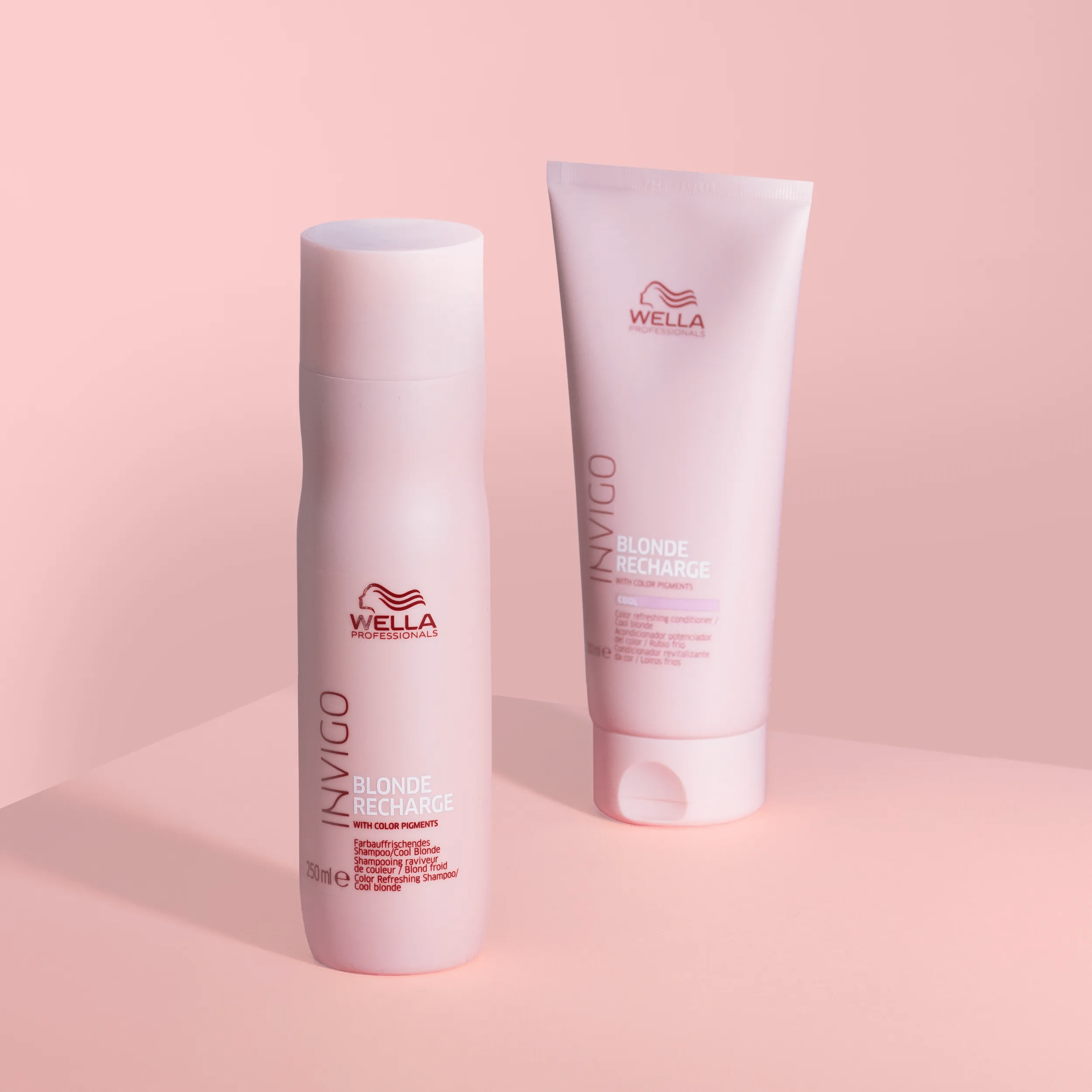 Pack shot of Invigo Blonde Recharge Cool Blonde Colour Refreshing Conditioner pink tube & Invigo Blonde Recharge Cool Blonde Colour Refreshing Shampoo pink bottle