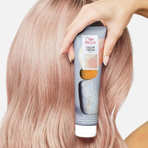 Model holds Color Fresh Mask in Pink Blush.