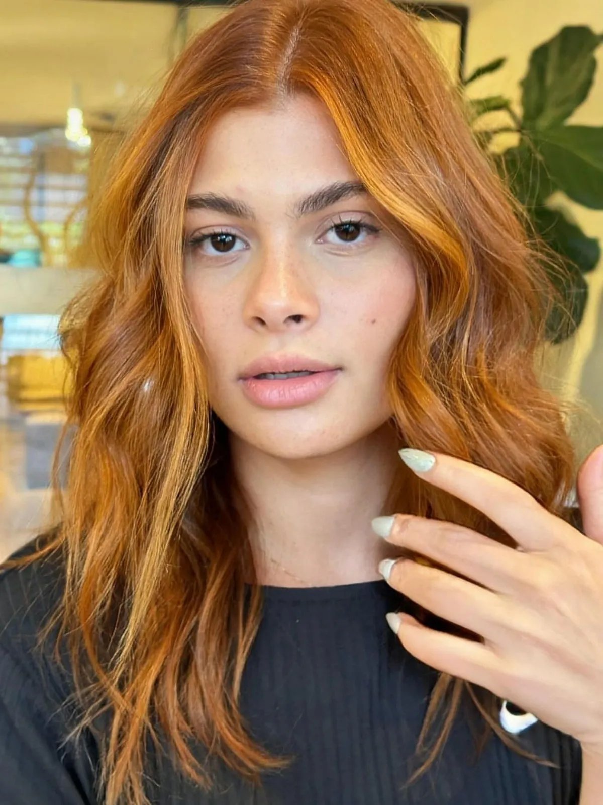 Copper hair with blonde face-framing highlights on front layers.
