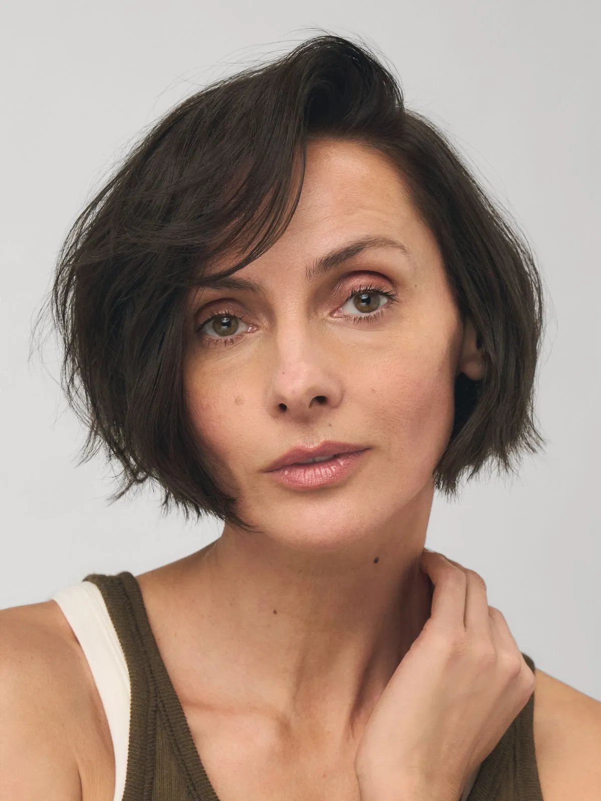 Model with ash brown bob haircut.