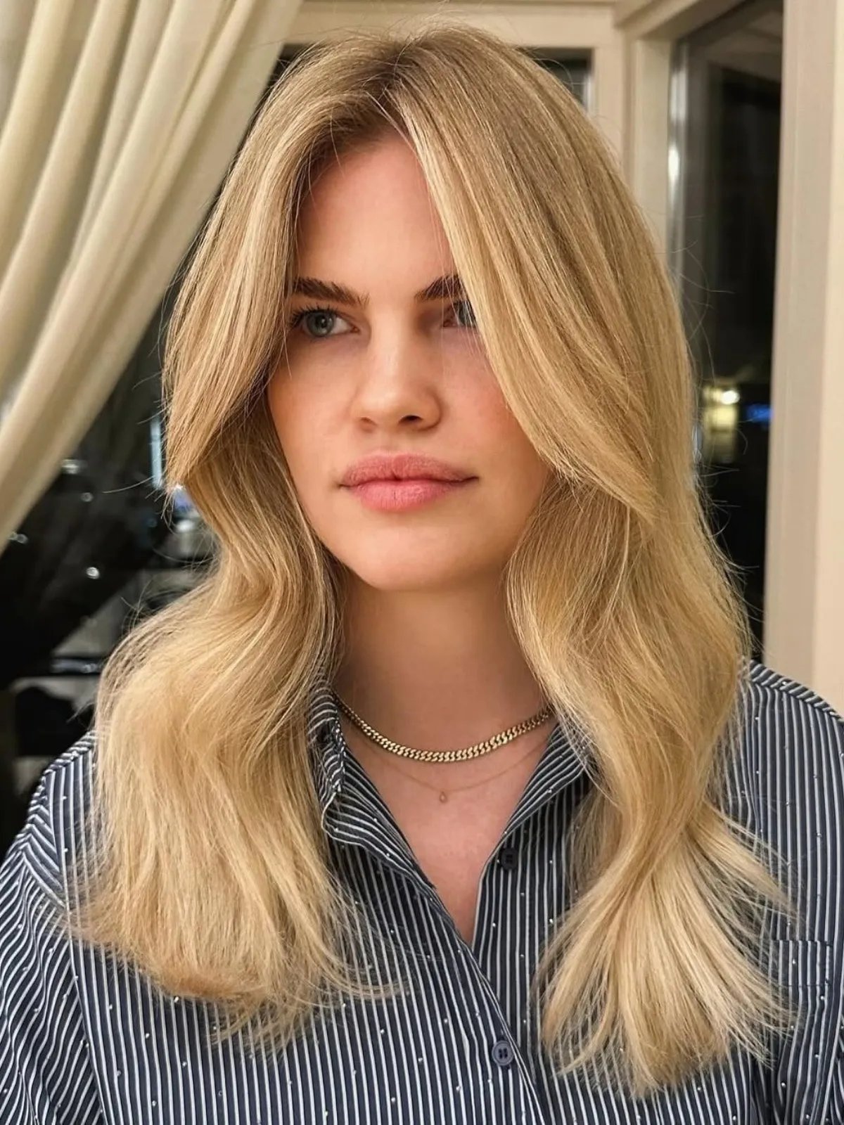 Model with long, loosely tousled, butter blonde hair.