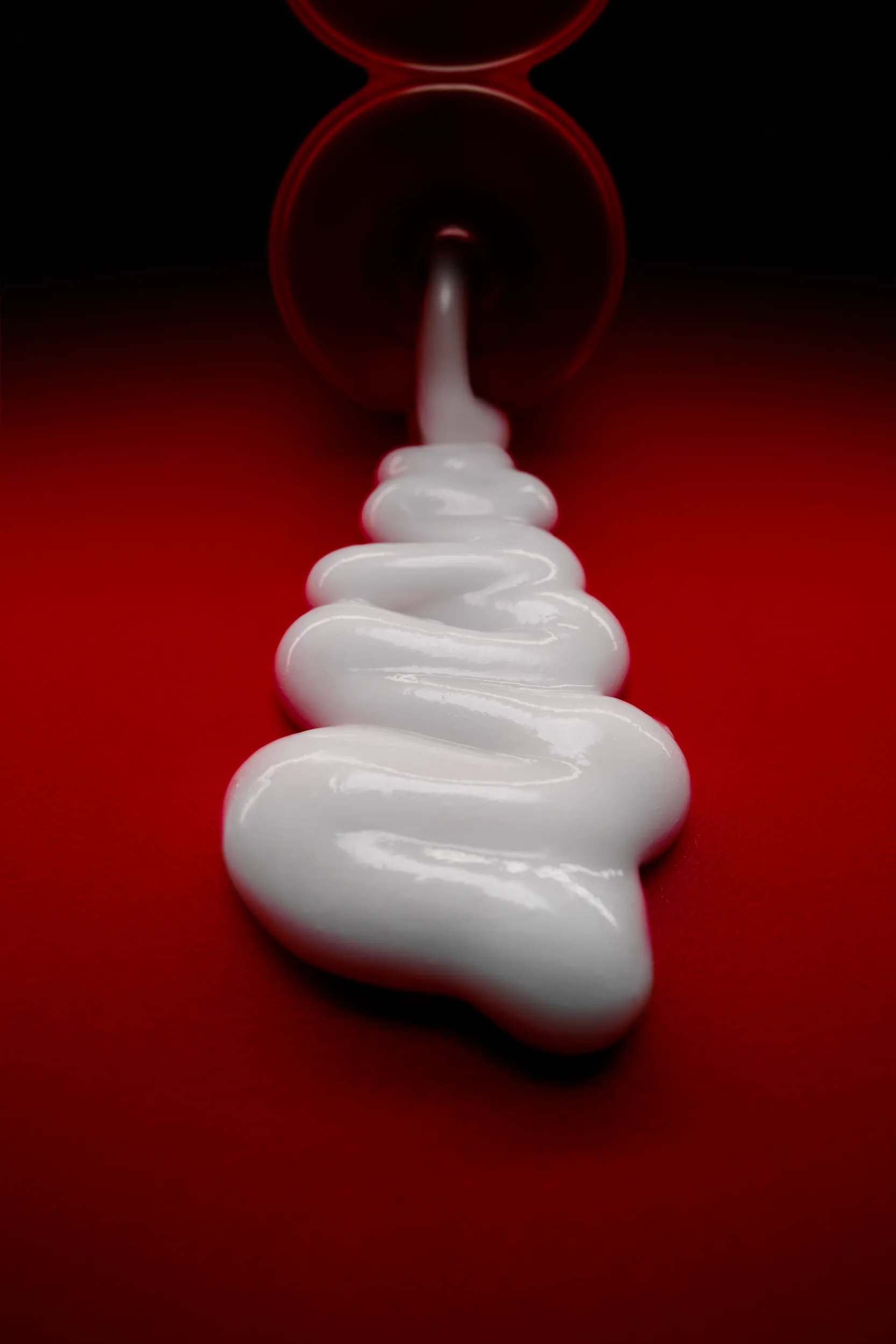 Ultimate Repair Conditioner over a red background