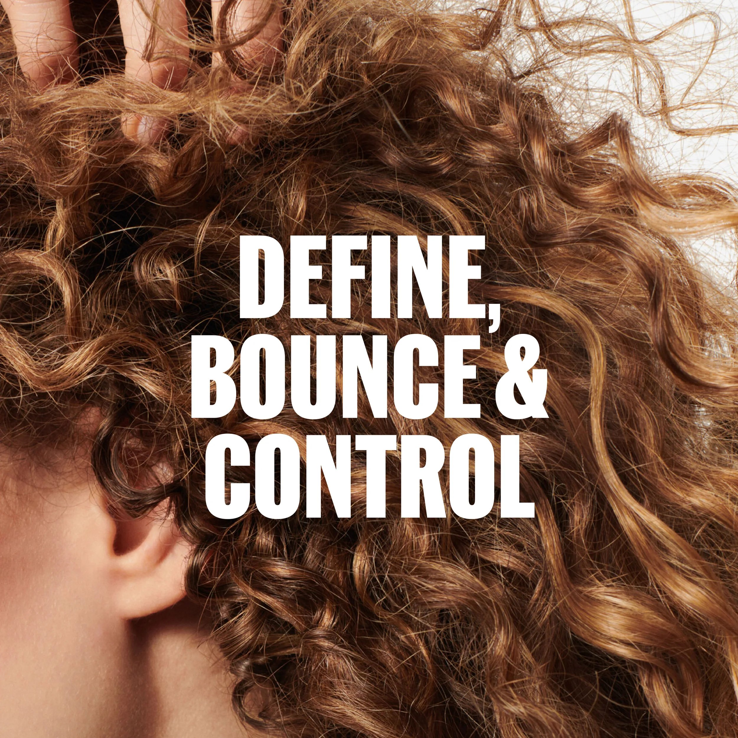 Close-up of curly, textured brown hair with the text “DEFINE, BOUNCE & CONTROL" overlaid in white.