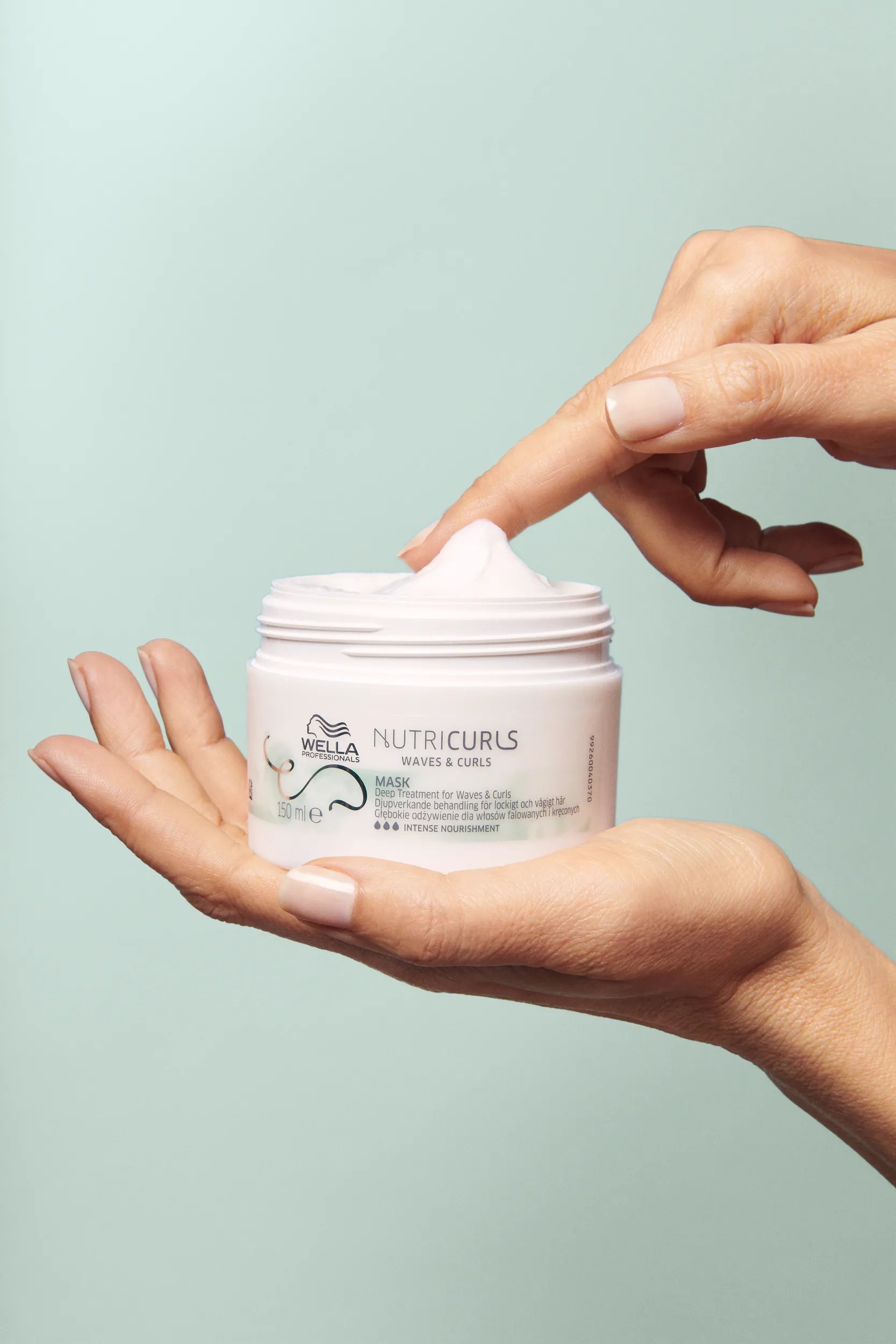 Model holding Nutricurls Deep Treatment Mask
