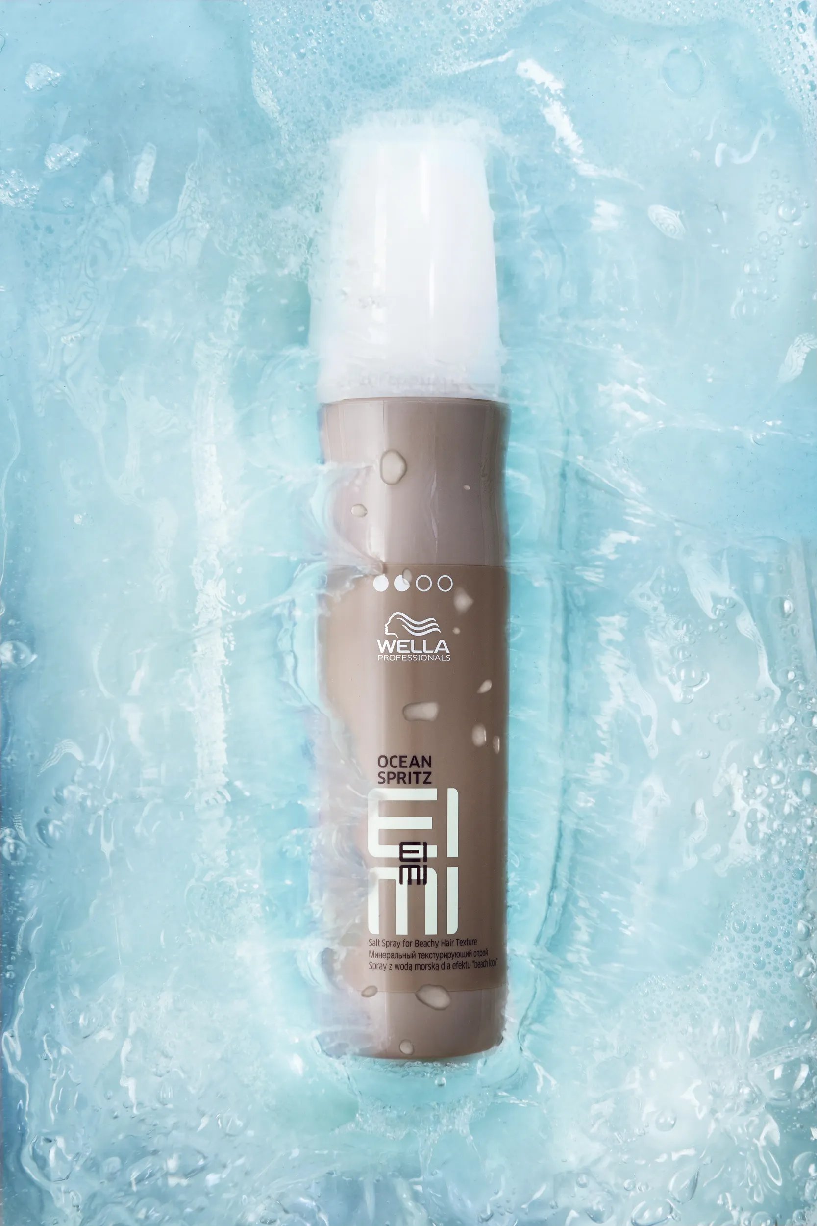 EIMI Ocean Spritz floating in clear blue water.