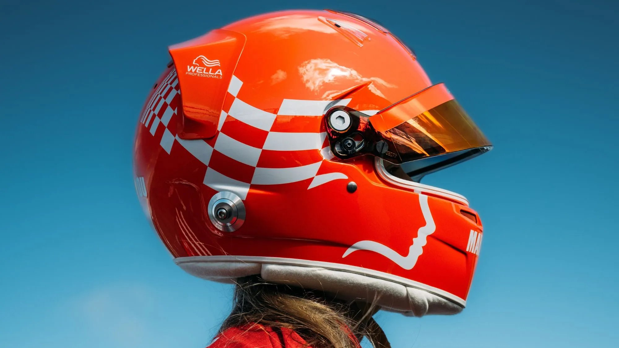 Chiara Bättig wearing the Wella red racing helmet.