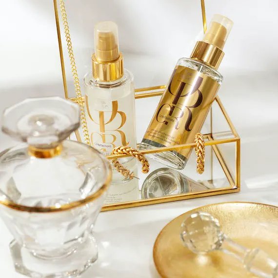 Oil Reflections Luminous Smoothing Oil in a gold box.