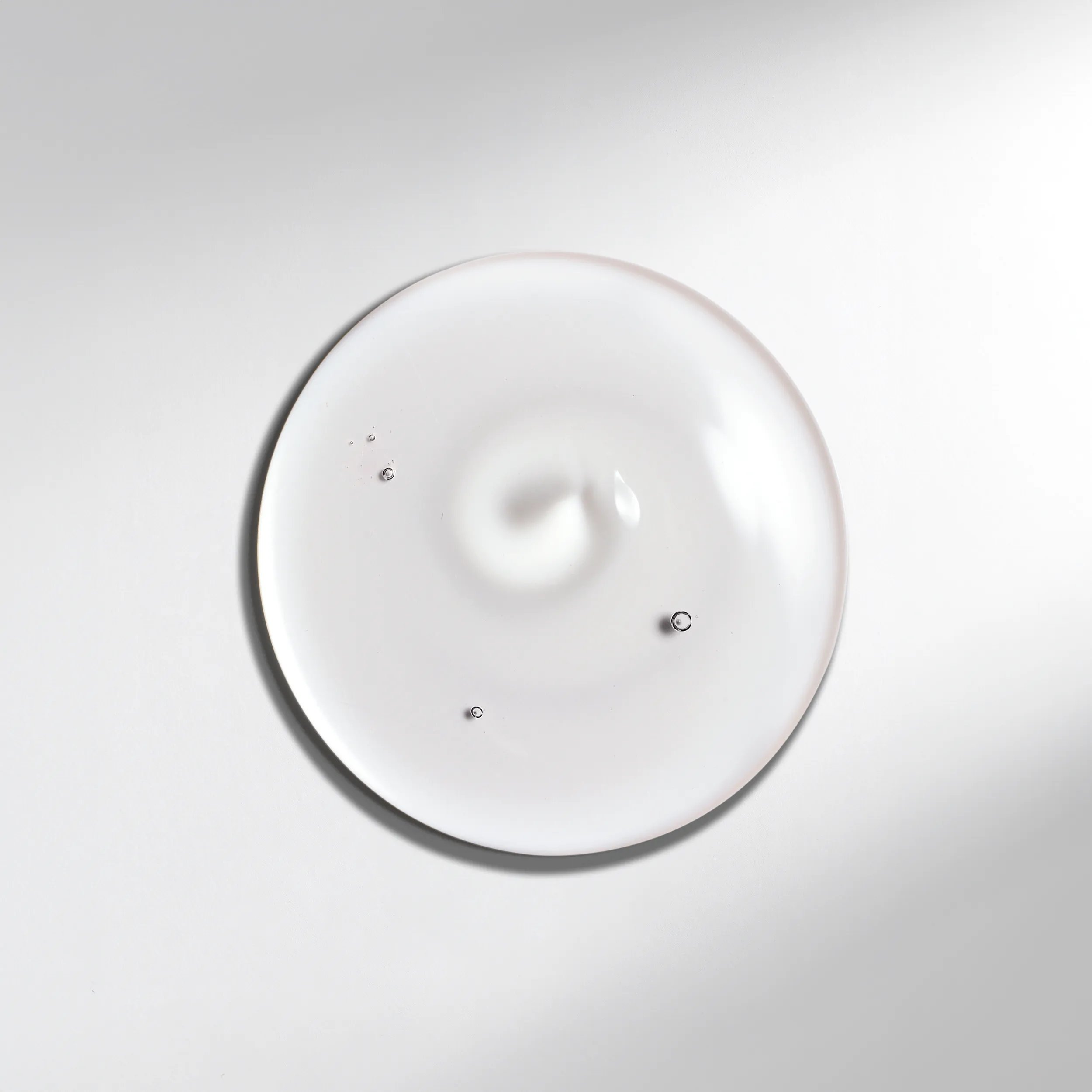 Drop of Wella Professionals Ultimate Smooth Shampoo to help demonstrate texture.