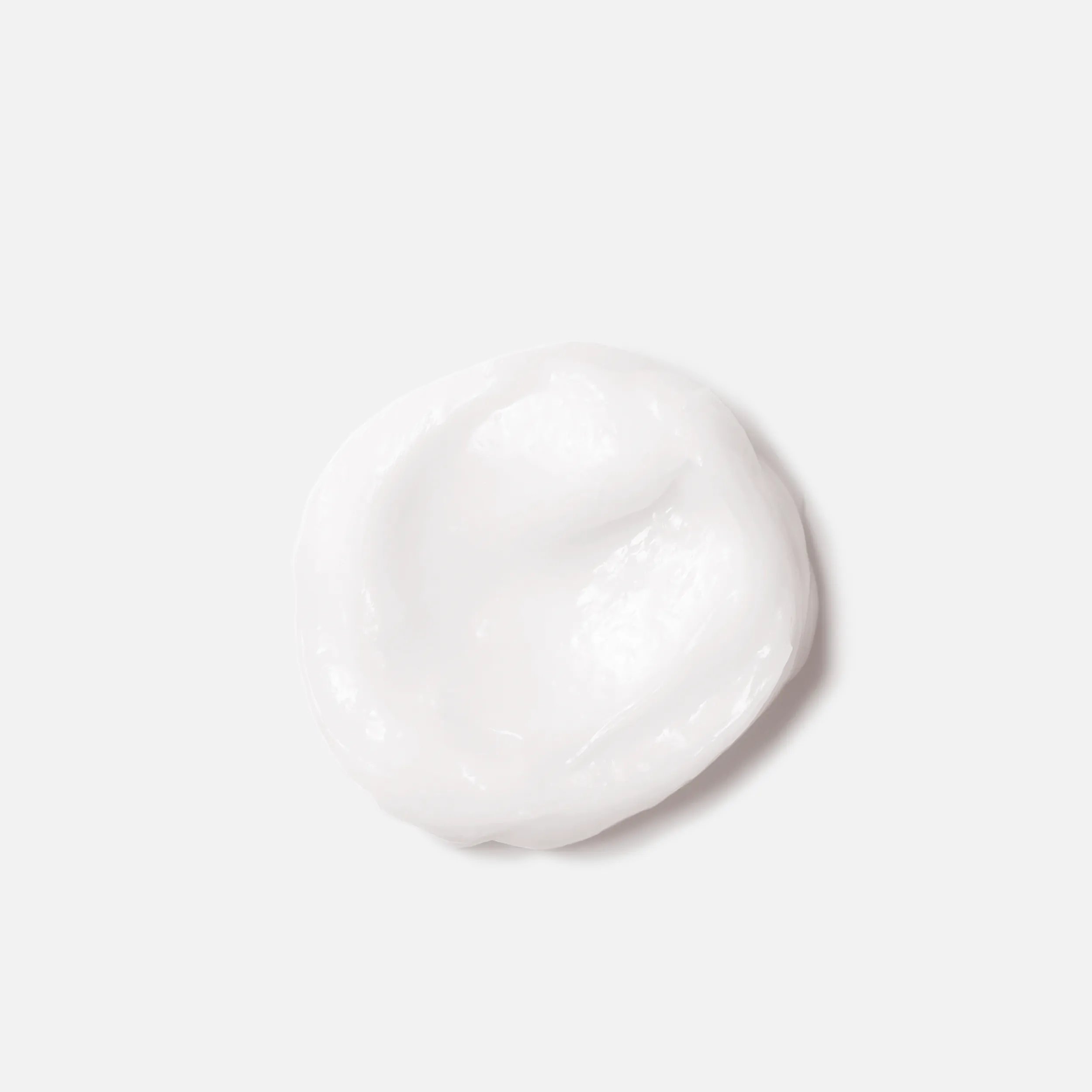 Close-up photograph of a circular blob of Elements Renewing Mask product on a white background.