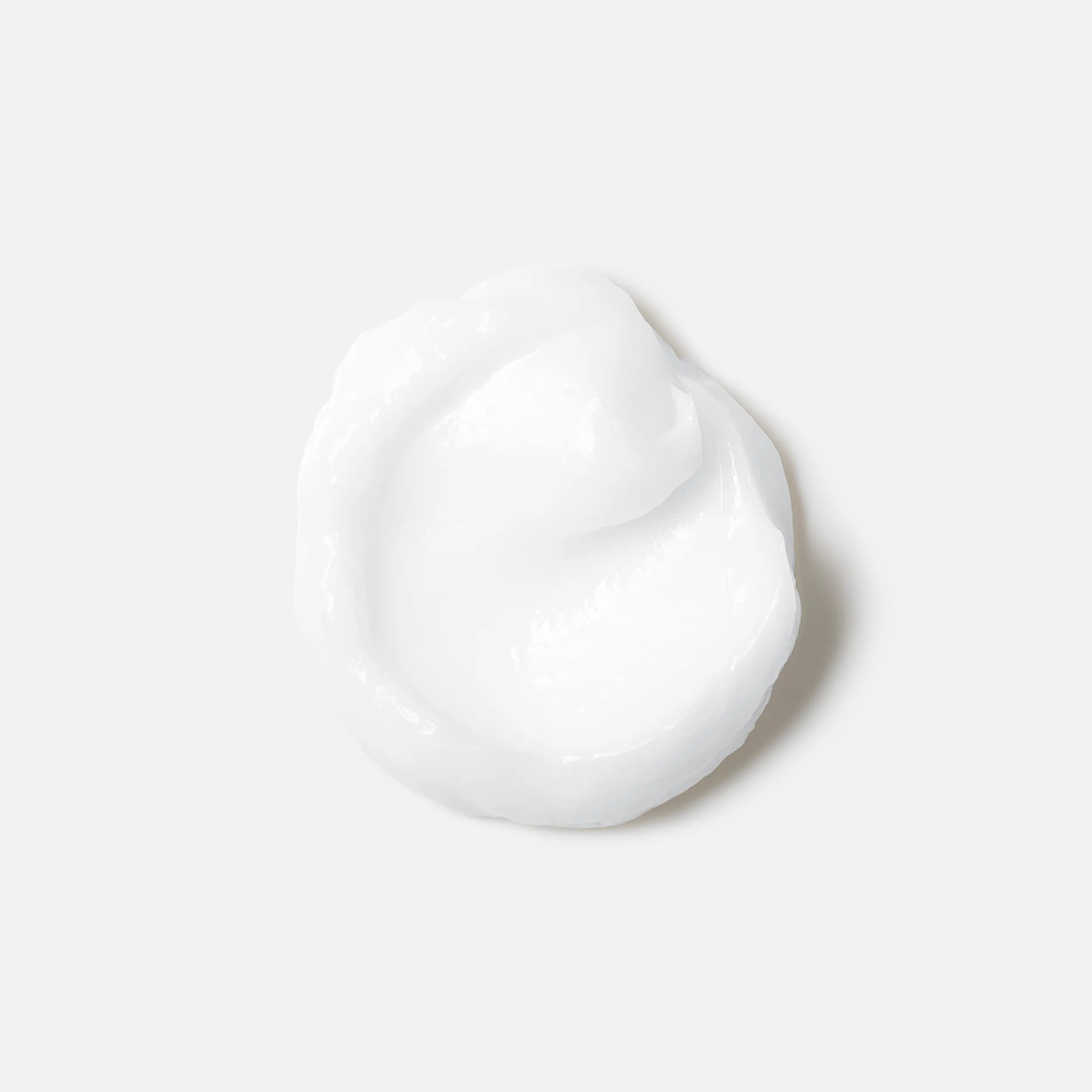 Drop of Wella Professionals Oil Reflections Luminous Instant Conditioner to demonstrate texture.
