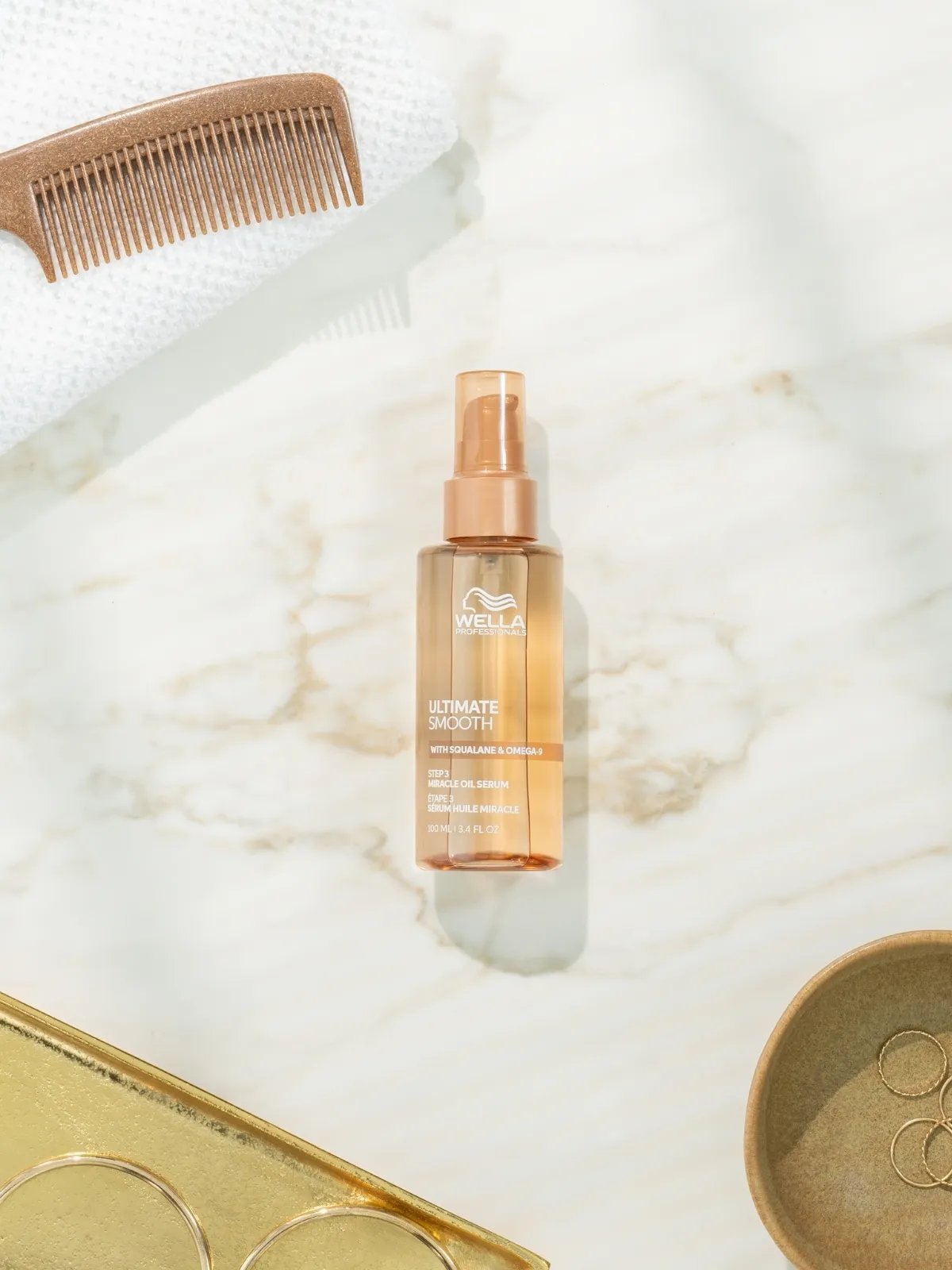 ULTIMATE SMOOTH Miracle Oil Serum on a marble surface.