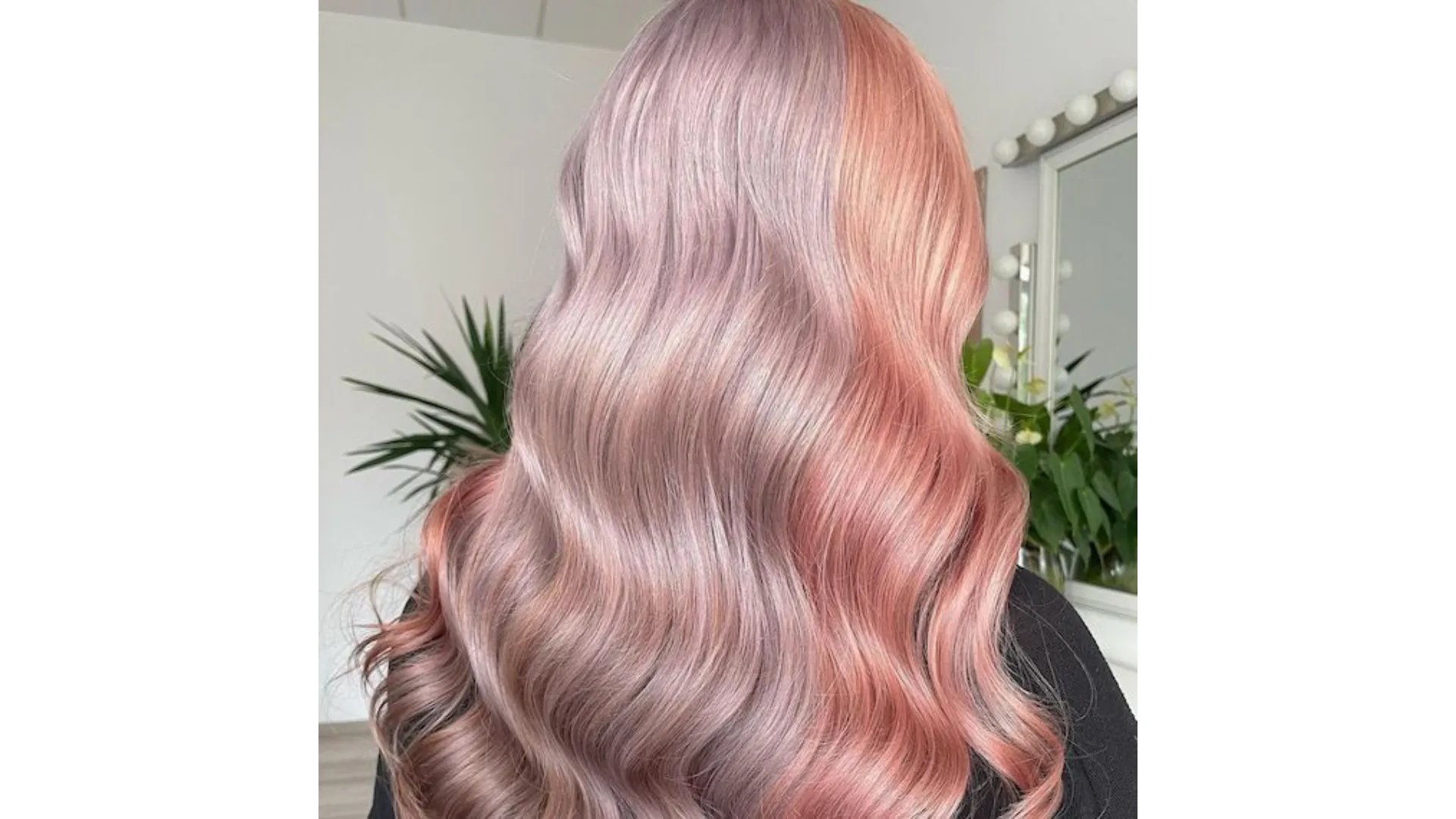 Model with pastel pink and lilac color block hair.