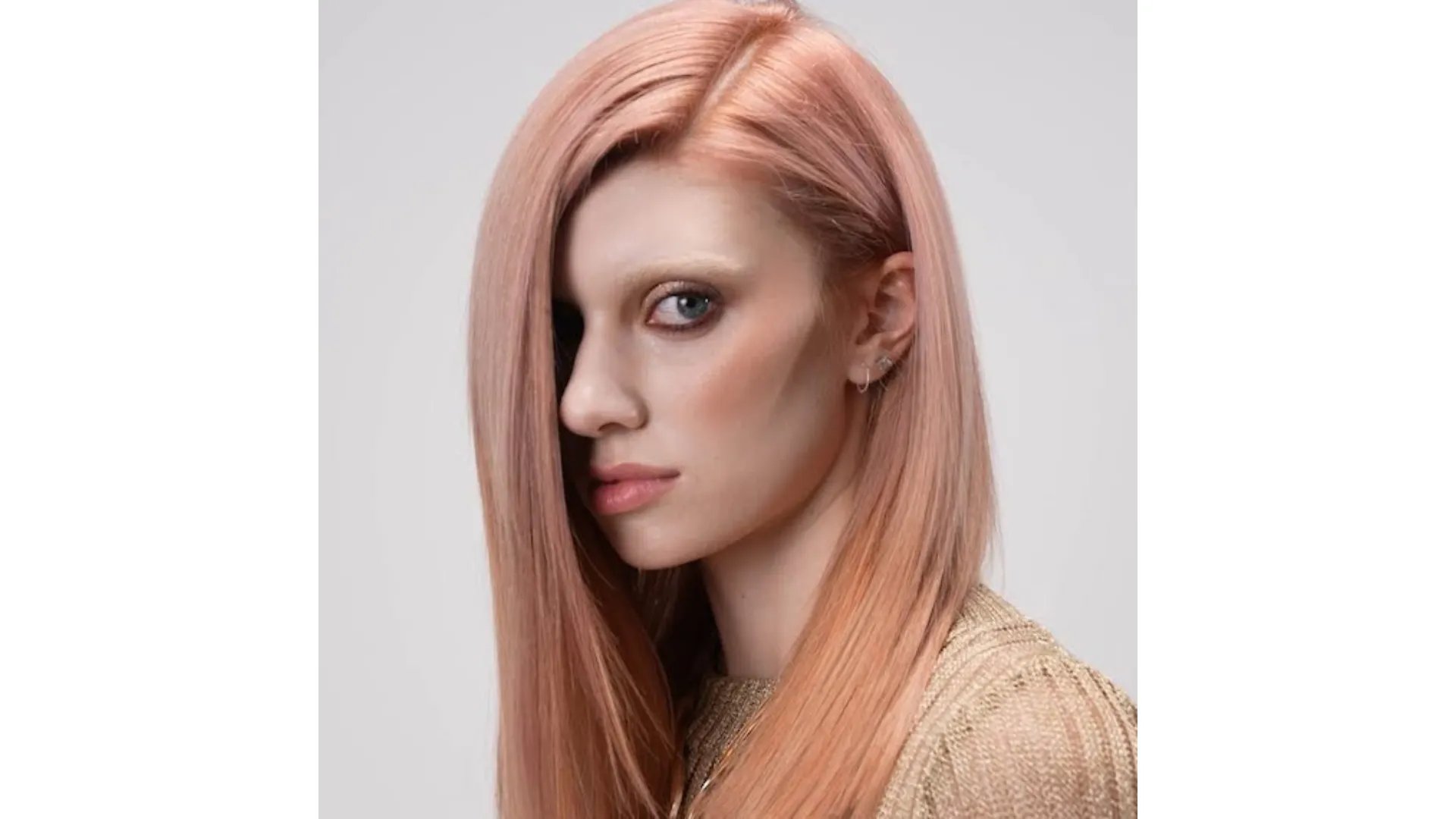 Model with ultra-sleek, rose glass hair.