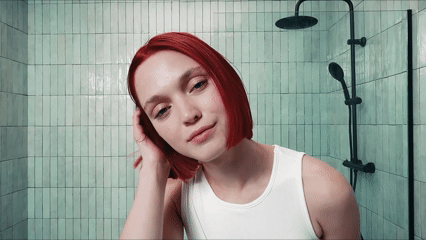 Four models: one with long, brown, curly hair, one with a cherry red bob, one with caramel curls and one with straight, platinum blonde hair.