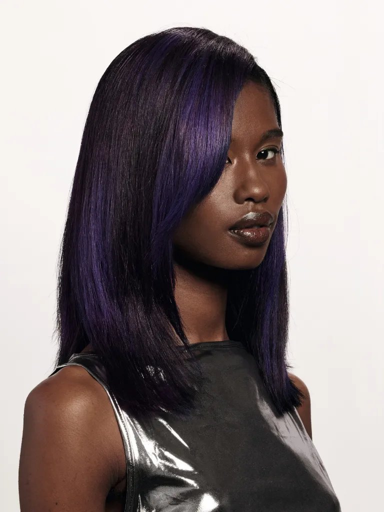 Model with dark brown hair featuring blocks of violet color.
