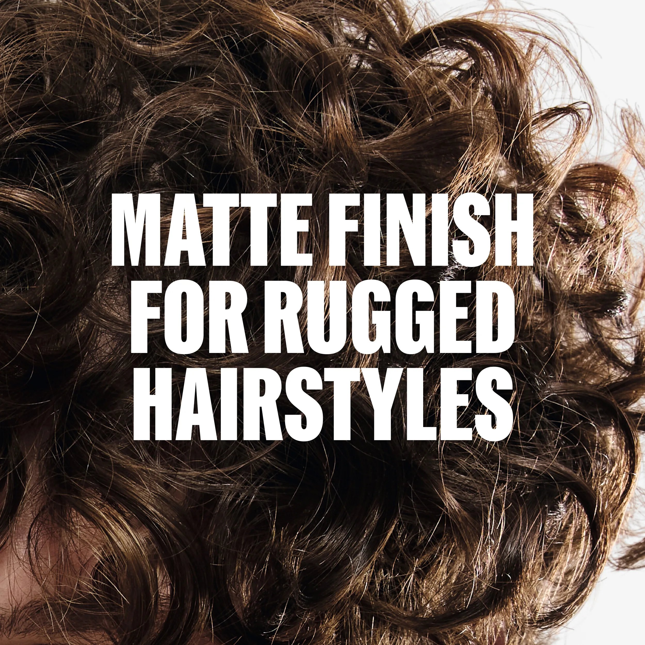 Close-up of curly, textured brown hair with the text "MATTE FINISH FOR RUGGED HAIRSTYLES" overlaid in white.