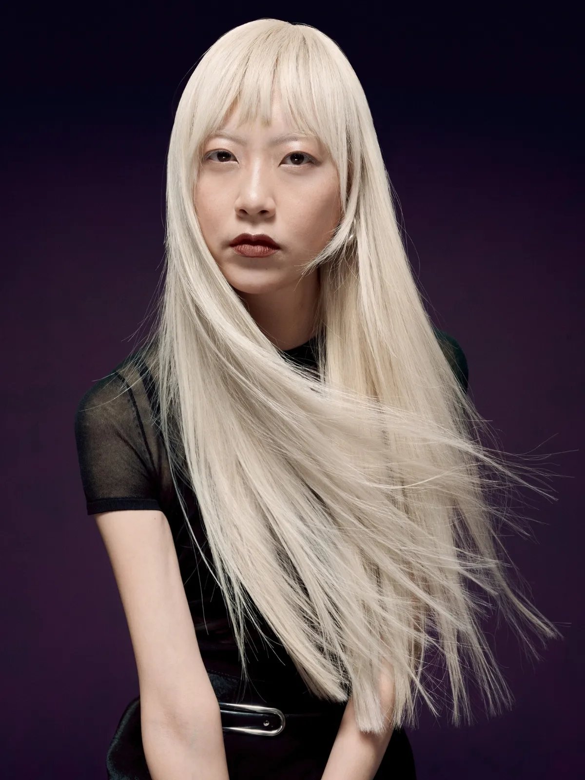 Model with long, straight, icy blonde hair.