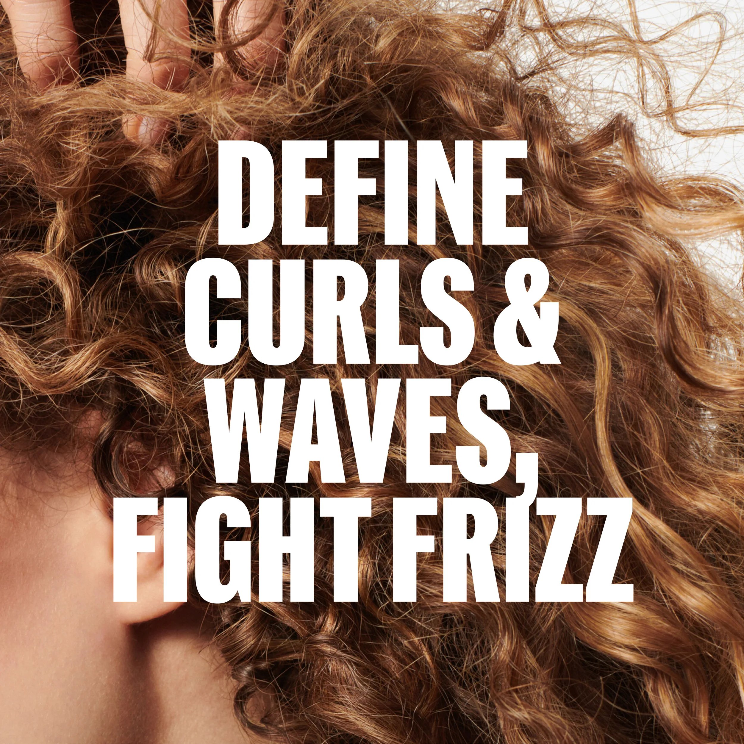 Close-up of curly, textured brown hair with the text “DEFINE, BOUNCE & CONTROL" overlaid in white.