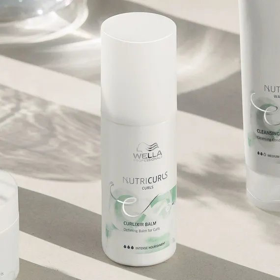 NutriCurls Curlixir Balm on a white surface.