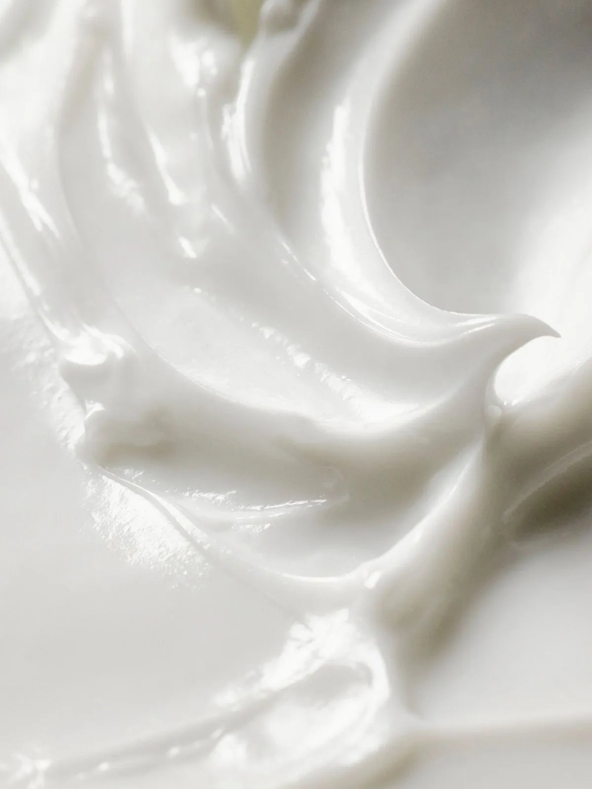 Close-up creamy texture shot of ULTIMATE COLOR Miracle Leave-In Mask.