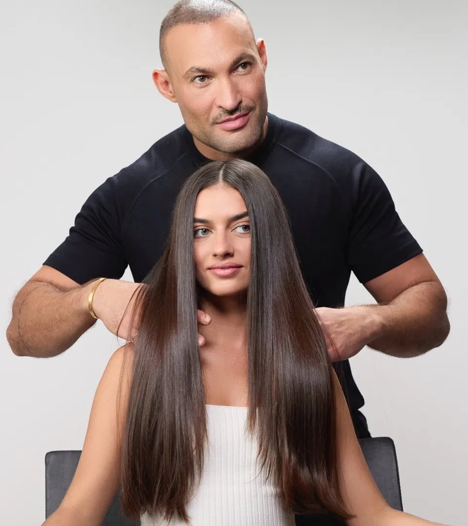 Hair stylist Romeu Felipe and a client are shown after the Smoothfiller treatment. 