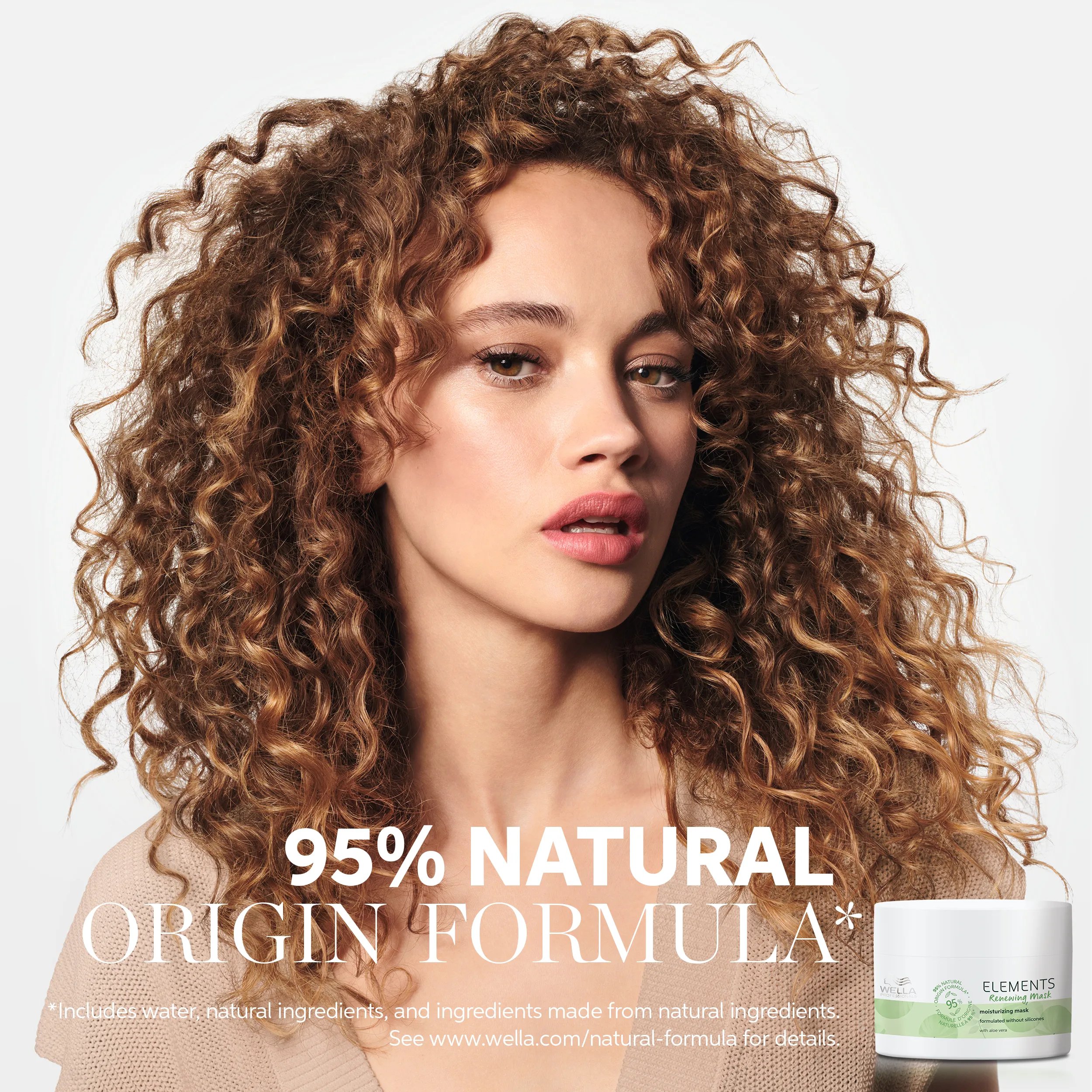 Image of a young female model with curly brown hair, with text overlaid saying '95% natural origin formula* *includes water, natural ingredients and ingredients made from natural ingredients. See www.wella.com/natural-formula for details.'