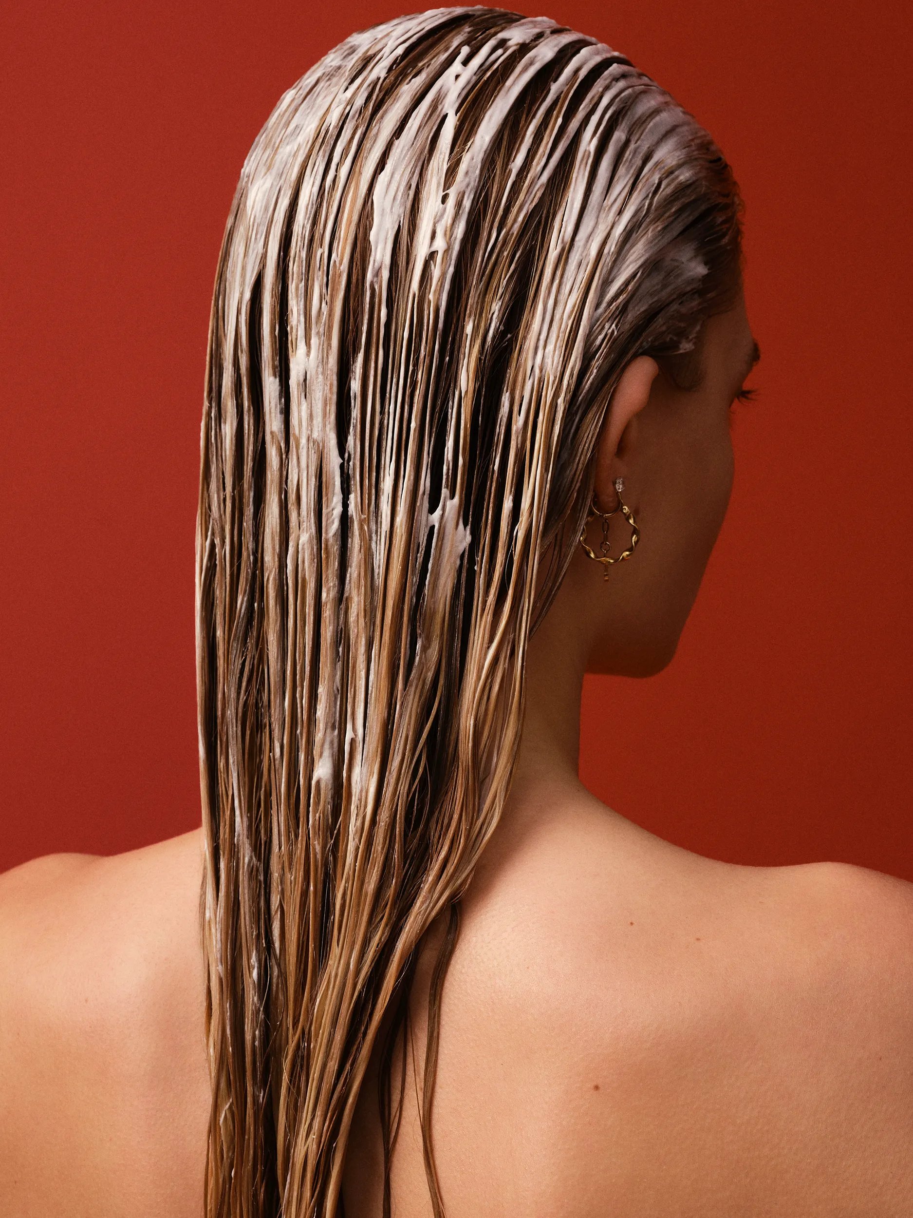 Photograph of a young female model with wet blonde hair