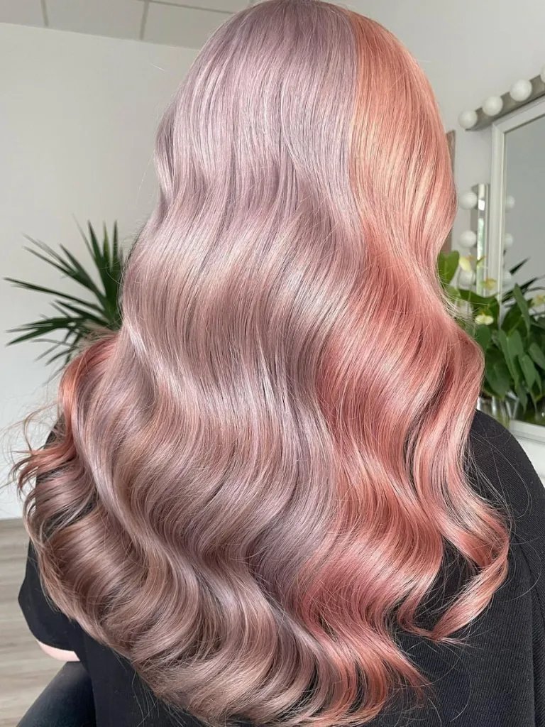 Back of model’s head with loosely curled pastel pink and purple hair in color blocks.