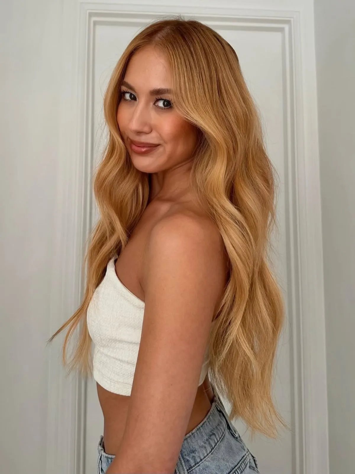 Color profile: Warm copper-red.
Who it's for: All skin tones, with the tone tailored to suit your undertone.
If you're already blessed with red hair (natural or not), give it a fresh, glowy topcoat with a hair gloss. At your nearest Wella salon, a SHINEFINITY gloss will enhance copper tones with glass-like shine, a hydration boost and zero damage. The all-in-one color gloss refreshes your red in just 5-20 minutes, so you can drop in during your lunch break for a speedy boost. Plus, with 2% Hyaluronic Acid Complex, it's clinically proven to leave you with 60% smoother hair¹.
<h3>3. Copper Blonde Hair</h3>
