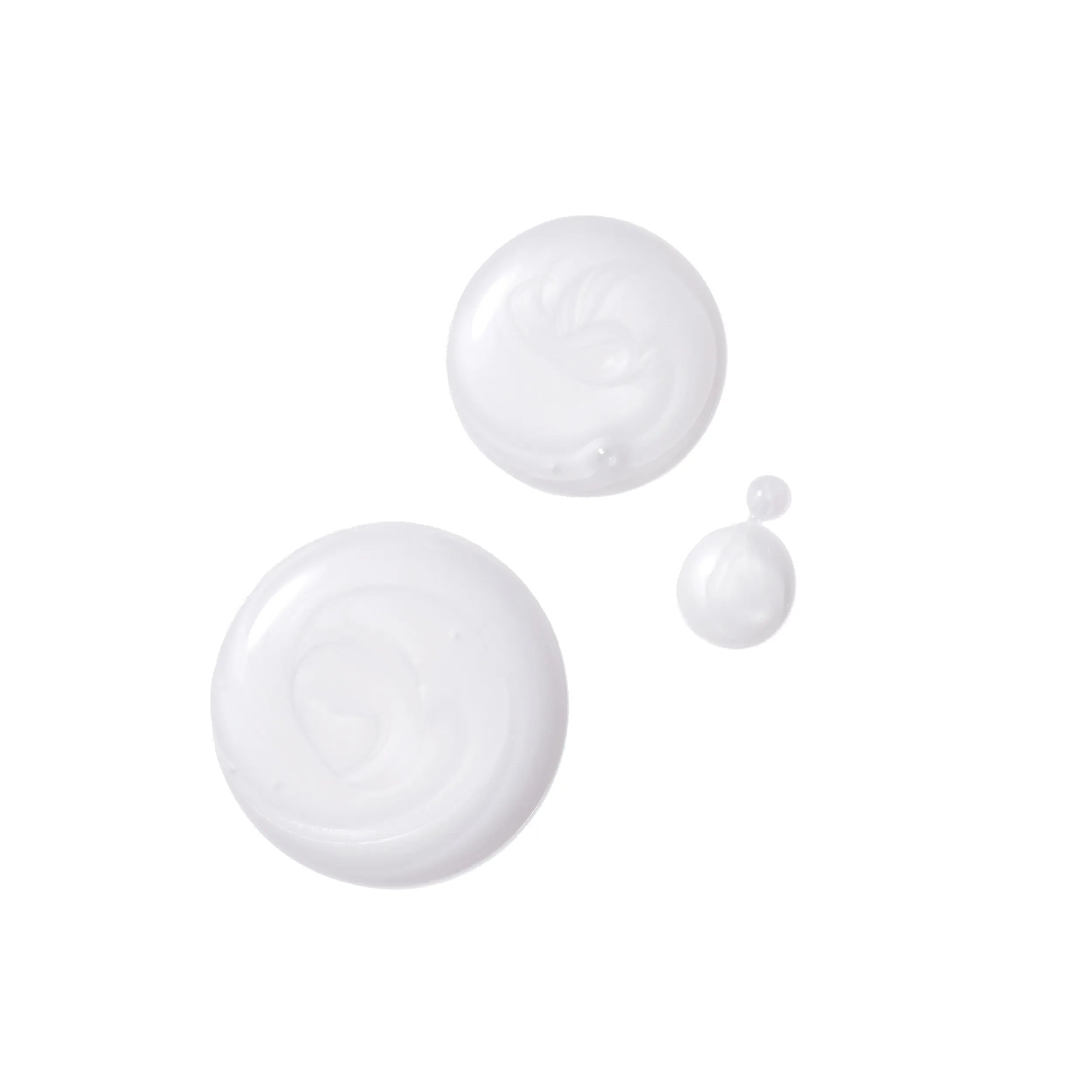 Close-up photograph of a circular blob of Invigo scalp balance sensitive shampoo on a white background. 