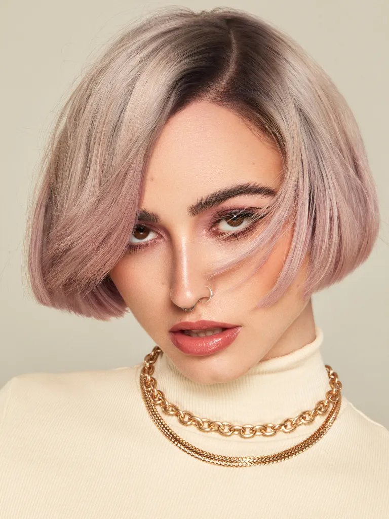 Model with ashy blonde, bob haircut.