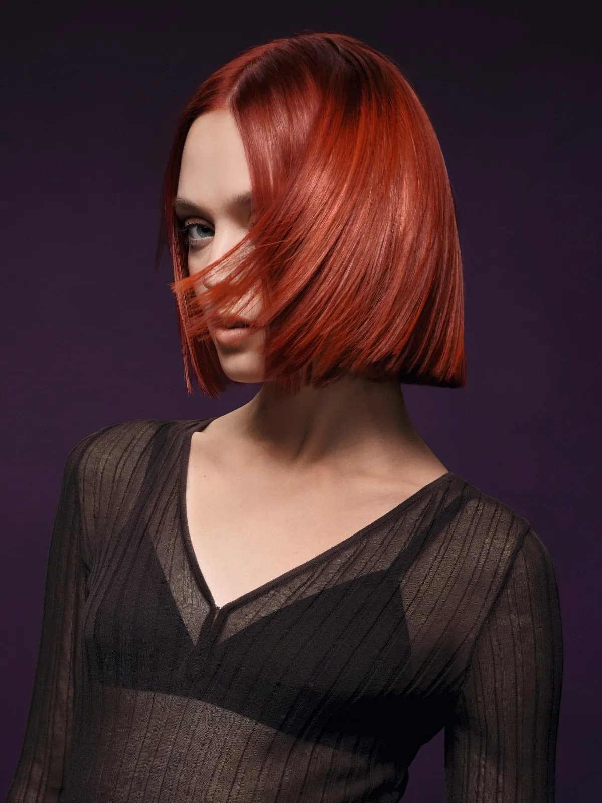 Before and after showing model’s red hair looking more vibrant after using ULTIMATE COLOR Intense Miracle Leave-In Mask.