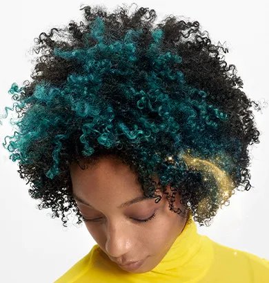 Model with dark, curly hair featuring an emerald green color block.