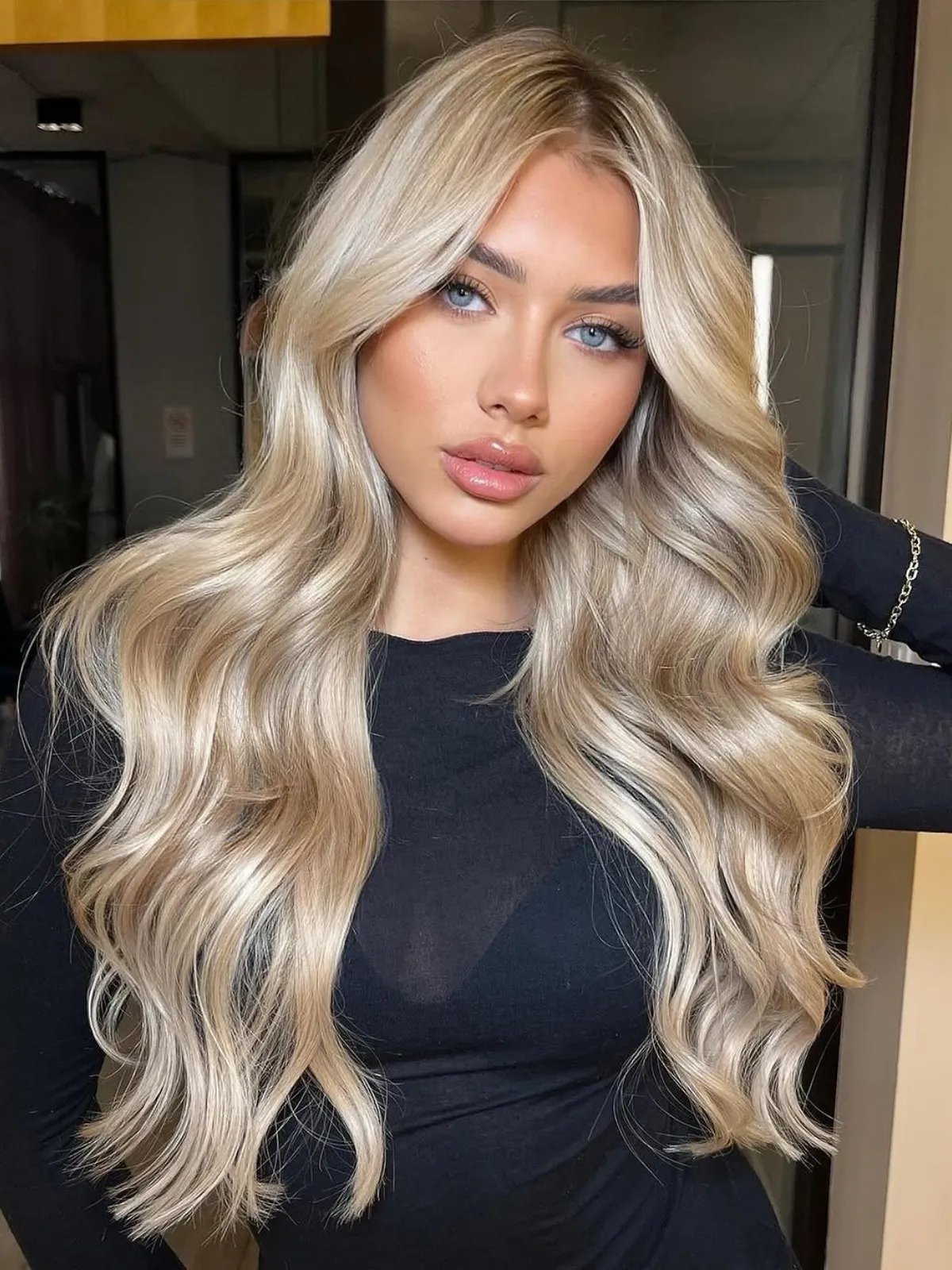 Model with long, wavy, golden pearl blonde hair.