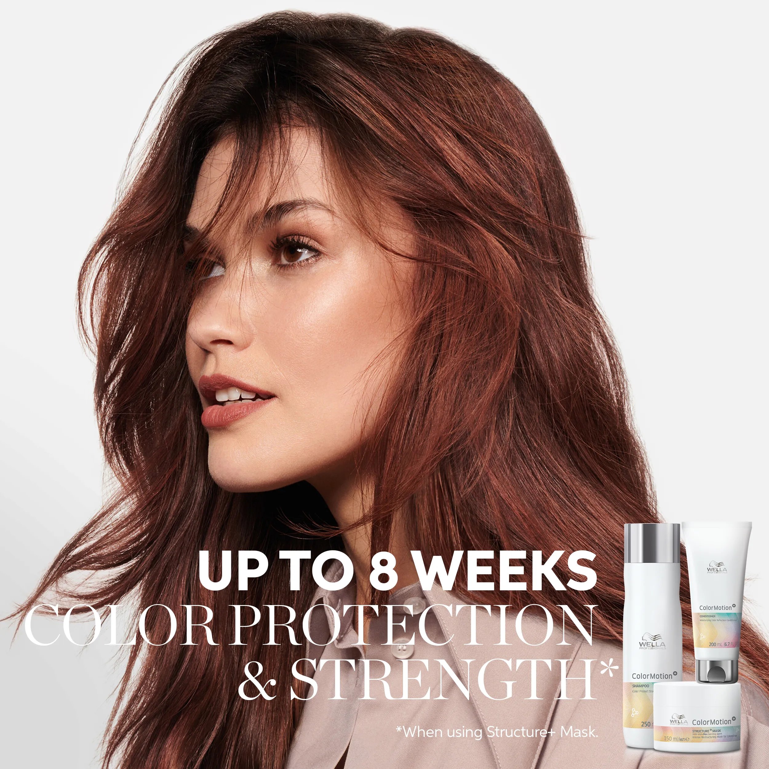 Image of a young female model with tousled red hair, with text overlaid saying 'up to 8 weeks color protection & strength when using Structure+ Mask.'