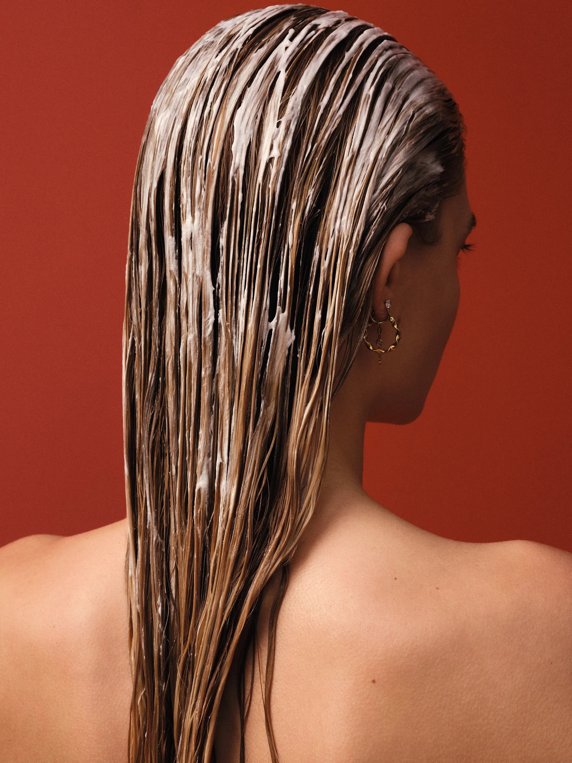 Model with long blonde hair with mask applied