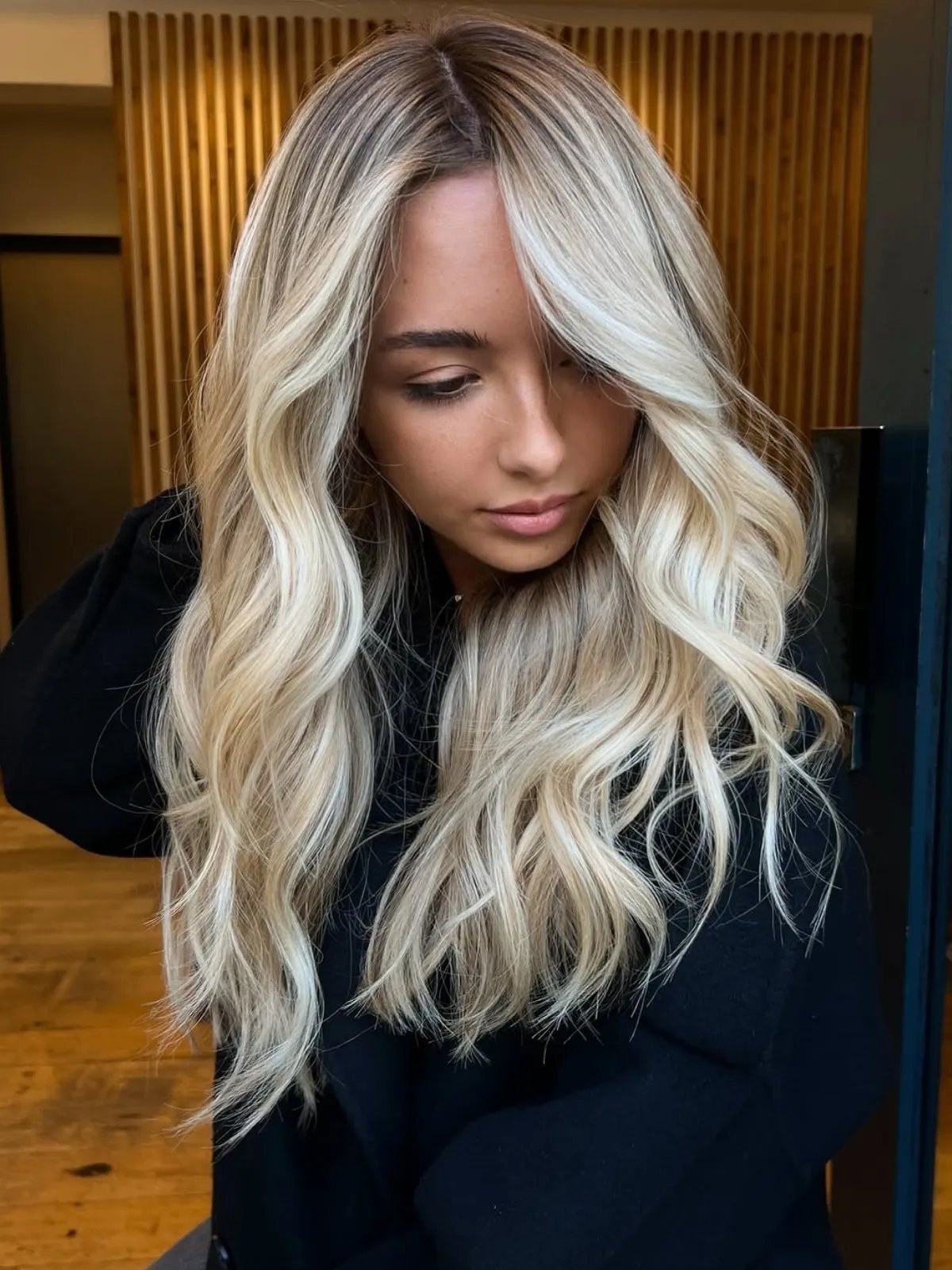 Model with beachy, tousled, champagne blonde hair.