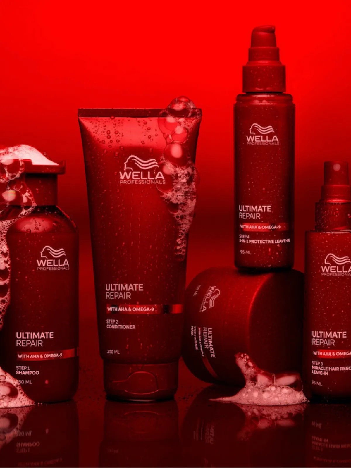 ULTIMATE REPAIR Shampoo, Conditioner, Mask, Miracle Hair Rescue and Protective Leave-In on a red background.