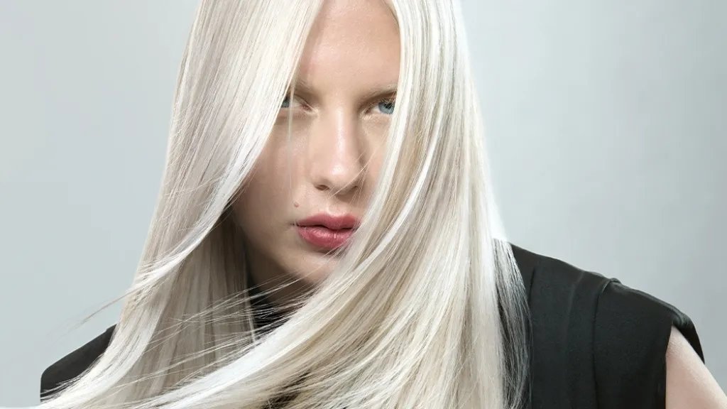 Model with long, sleek, icy platinum hair.