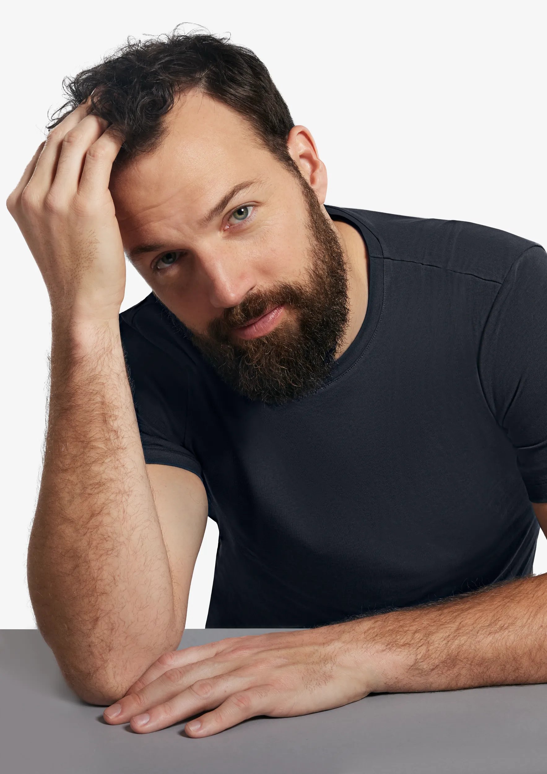 man touching hair