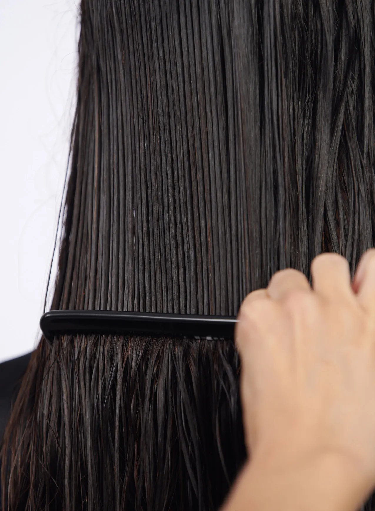 Before and after showing mid-length, blonde hair looking smoother after using Ultimate Repair Miracle Hair Rescue.