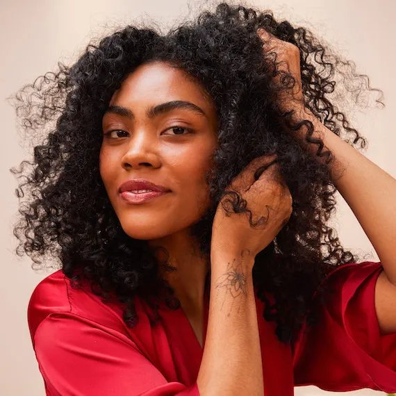 Model with black curly long hair
