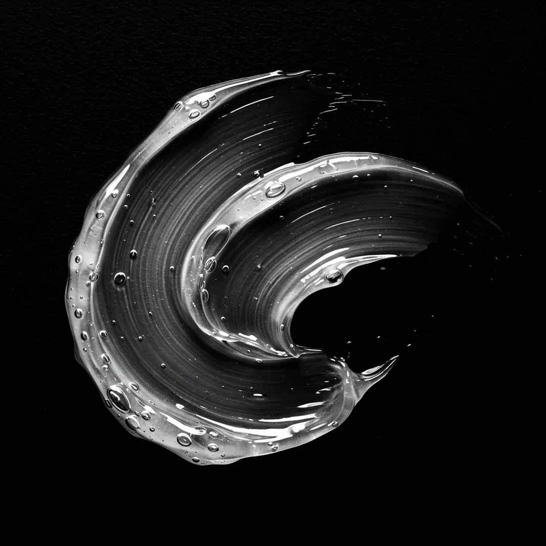 Bild von klarem Gel, das auf einen schwarzen Hintergrund verschmiert ist.