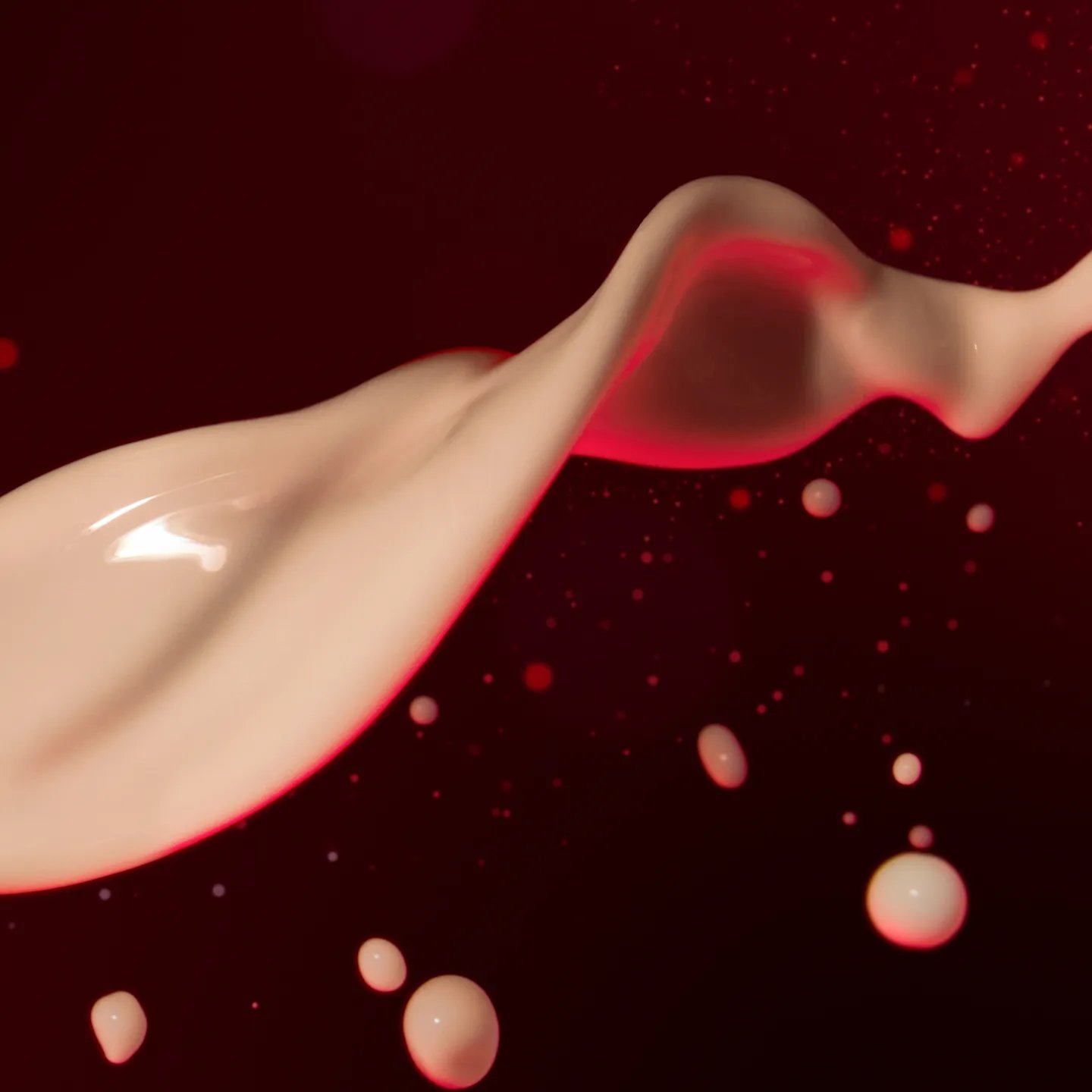 Close up of white droplets against red background.