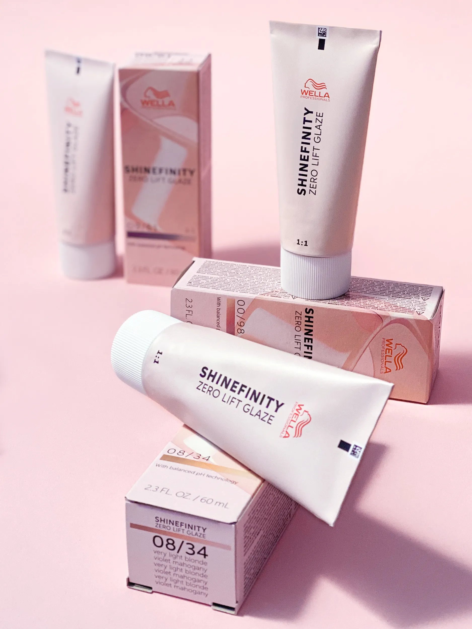 Shinefinity packs over a pink background
