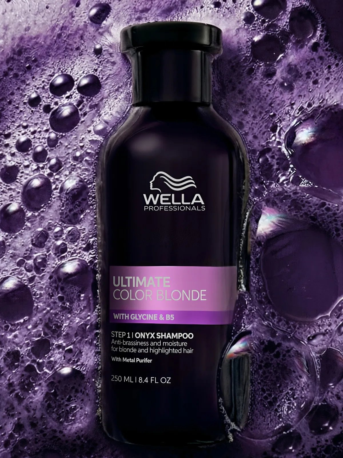 ULTIMATE COLOR BLONDE Onyx Shampoo surrounded by purple shampoo foam.