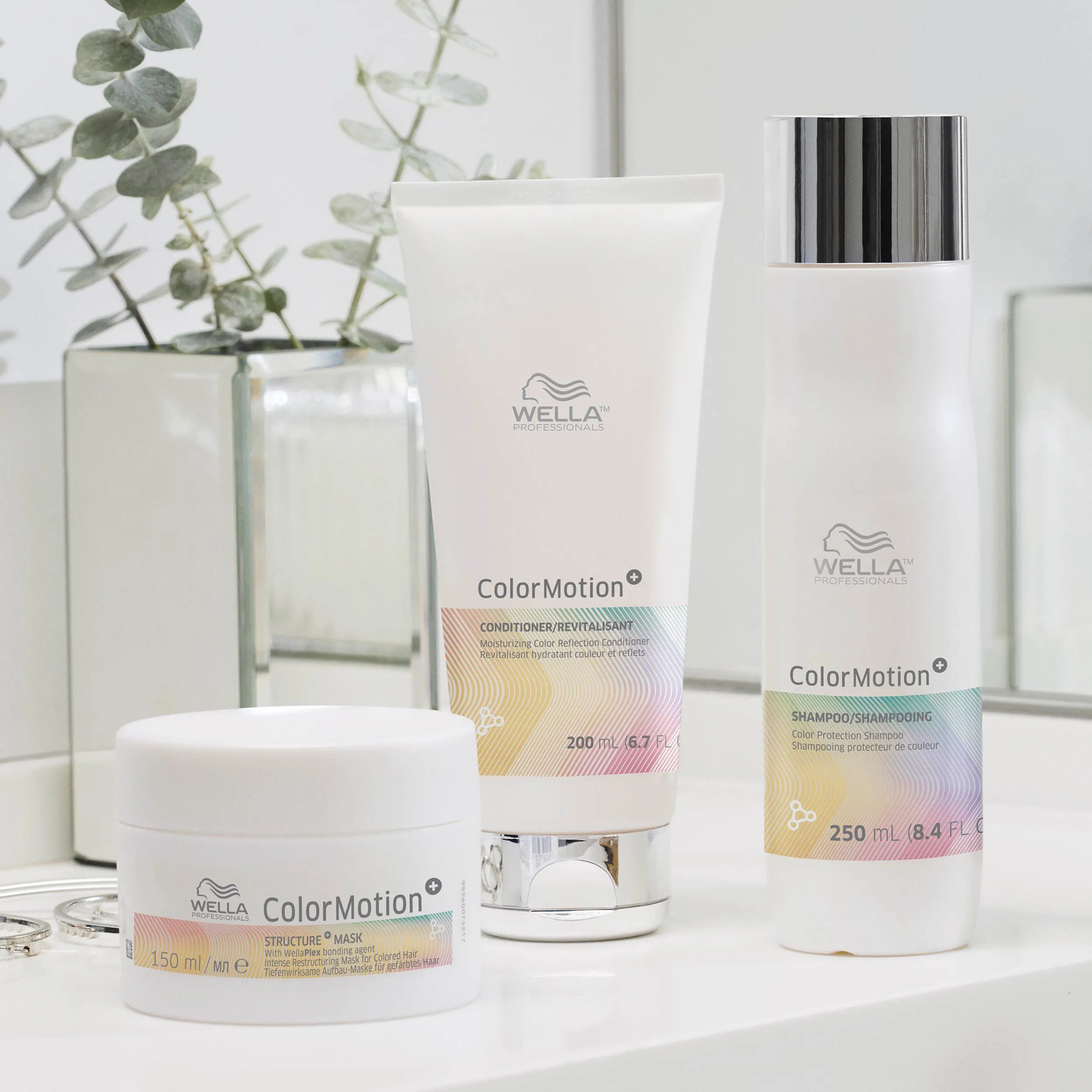 Wella Professionals ColorMotion+ products - conditioner, shampoo & structure mask - photographed on a bathroom shelf.